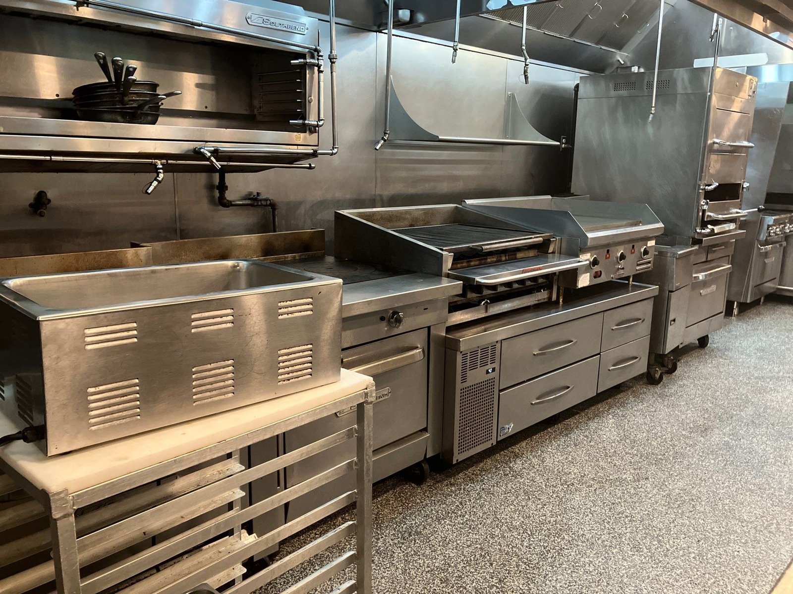 Dauphine's finished charbroiler and griddle cook line — NLI install