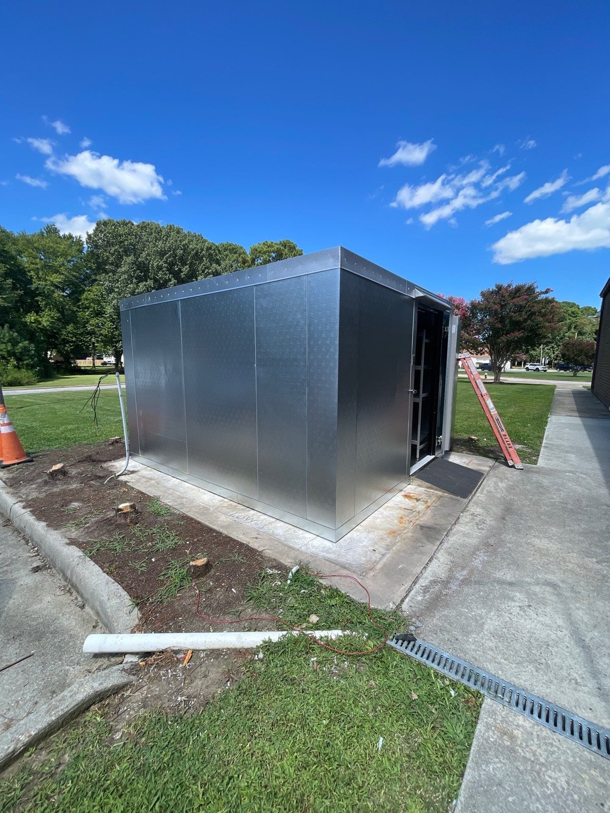 Poquoson walk-in cooler with door open — NLI refrigeration install