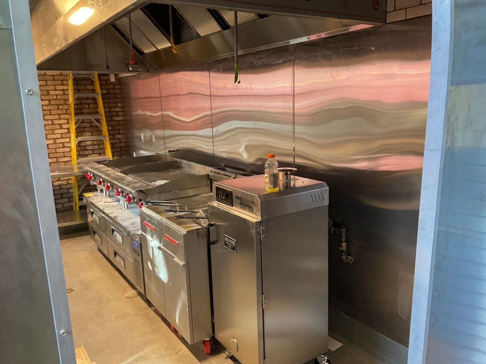 Bodega griddle fryer under hood — NLI install
